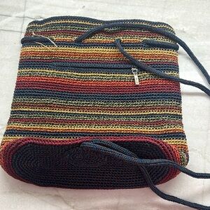 The Sak backpack style purse. Blue, maroon, olive, orange and yellow striped.